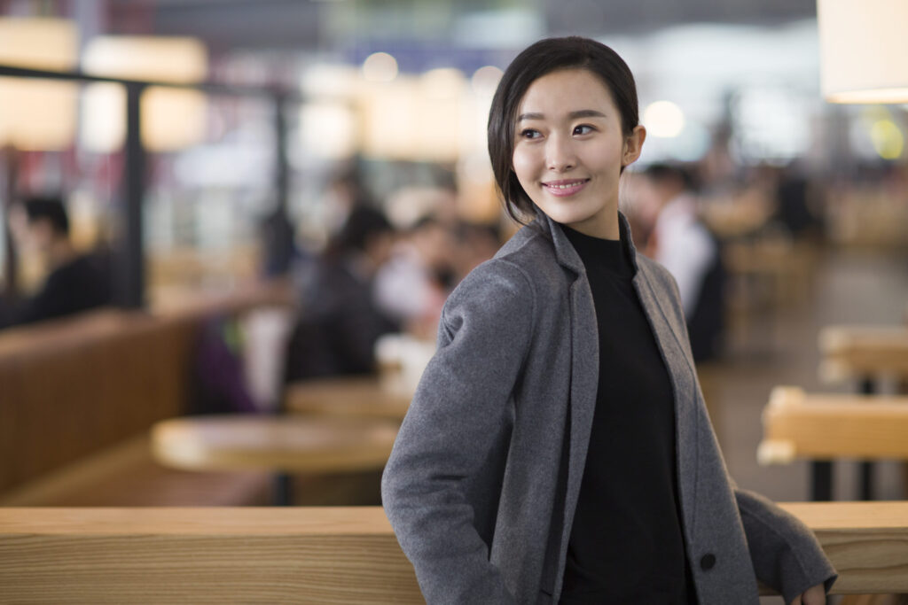Businesswoman in airport illustrating entrepreneurial journey and business setup.