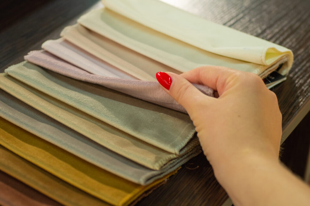 Stack of Minky fabric swatches in various colors and textures.
