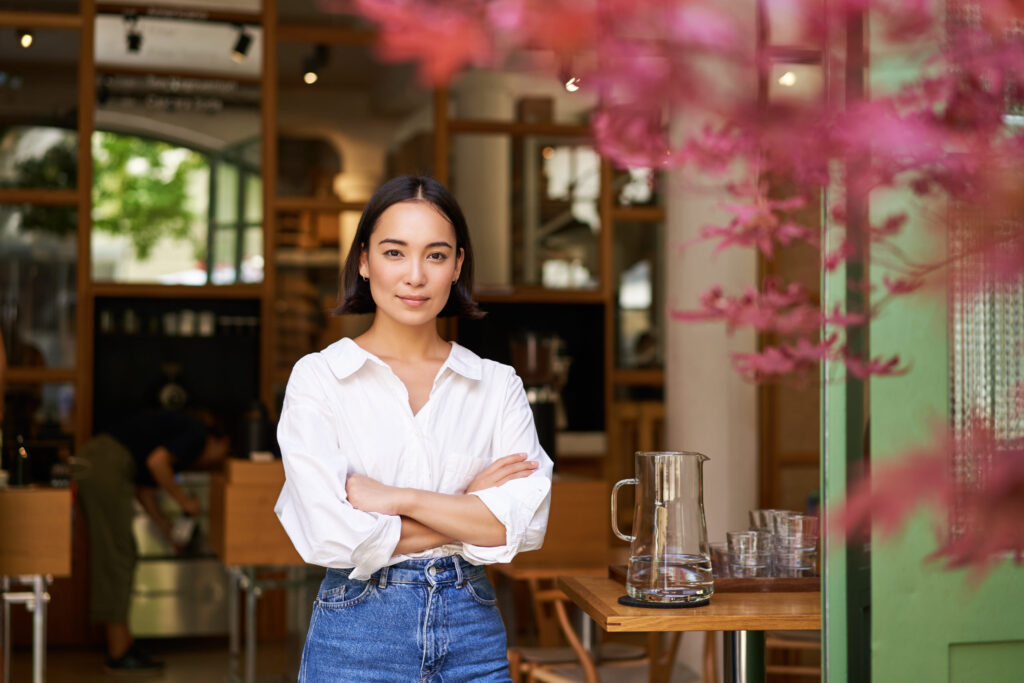 Young businesswoman in cafe, restaurant owner portrait, starting a restaurant business