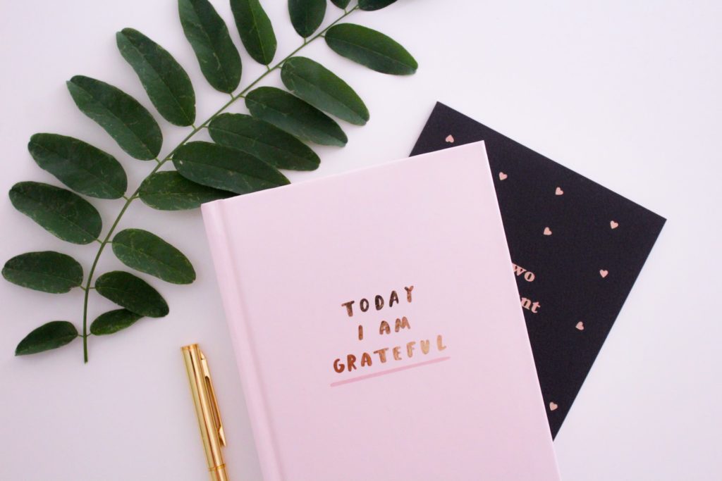 Notebook and pen for business management and entrepreneurship tips.