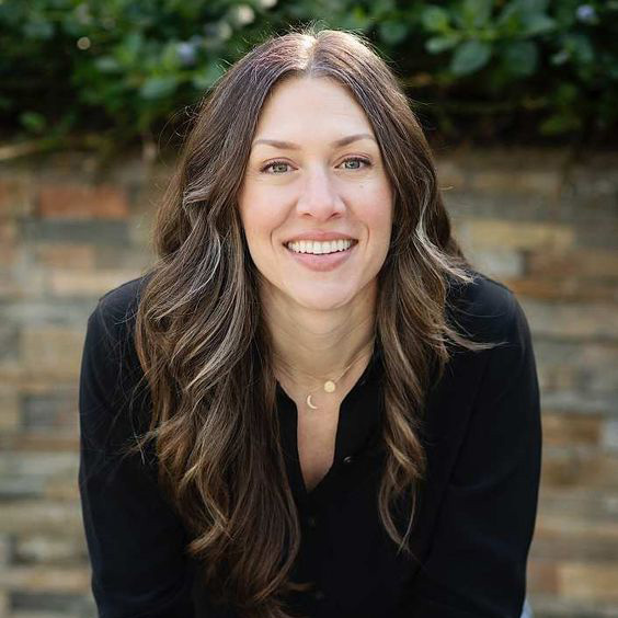 Learn More 23 Julia Bryant, author and Senior Editor at Shoot for the Edit, smiling portrait
