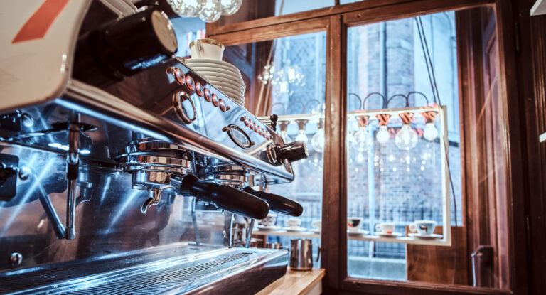 Commercial coffee machine in a cafe shop illustrating business management and marketing tips