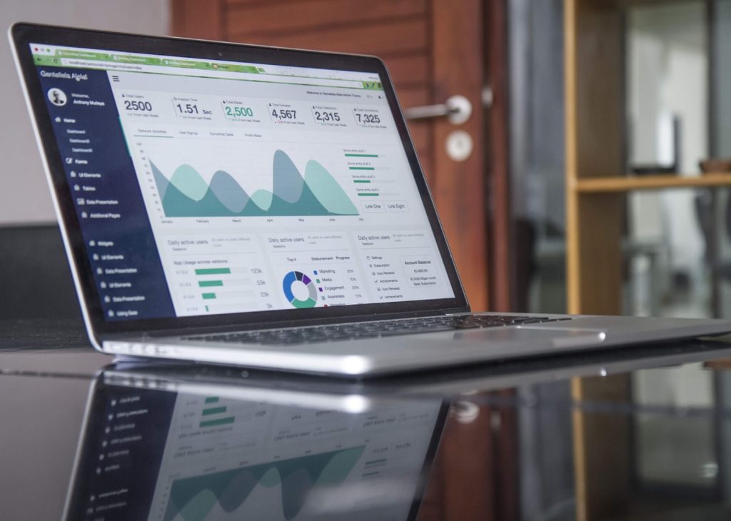 Laptop displaying data visualization and analytics dashboard for business insights.
