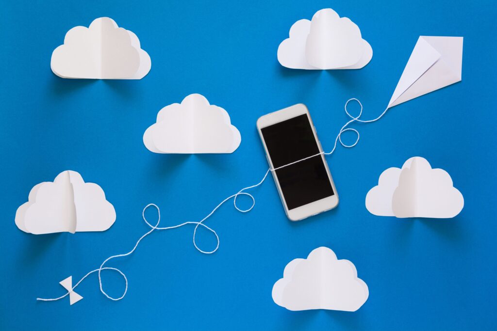 Cloud storage and mobile device connected by string, illustrating NetSuite ERP's cloud-based accessibility.