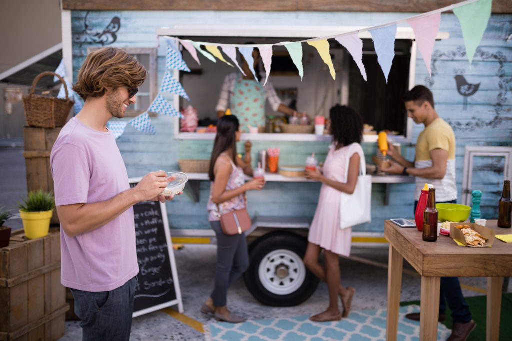 Creative marketing strategies and new customer engagement at a food truck event.