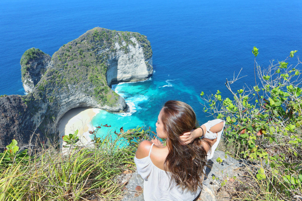 Scenic island view and woman traveling in 2020